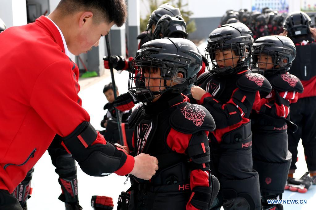 China's martial arts school builds ice hockey team Xinhua English