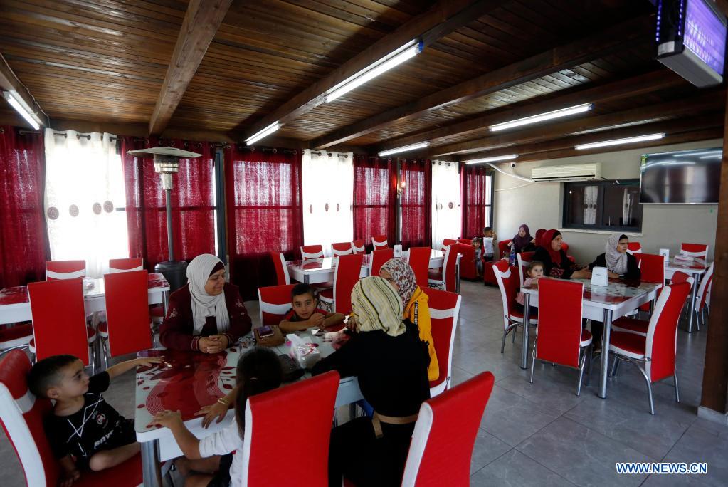 Feature Young Palestinian woman opens restaurant for ladies in remote