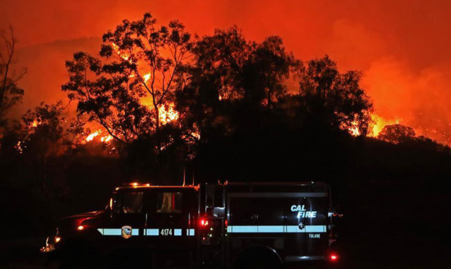 Dozens of wildfires burn across California