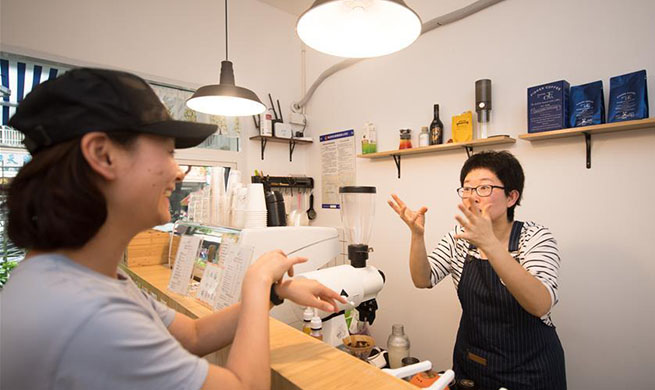 Hearing-impaired couple starts coffee shop in Hangzhou, China's Zhejiang