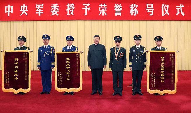 Xi signs orders to honor soldier, three military units