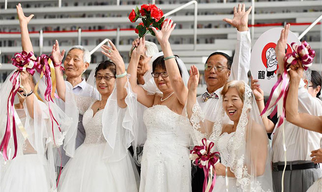 Elderly couples take wedding photos to mark Chinese Valentine's Day in Tianjin