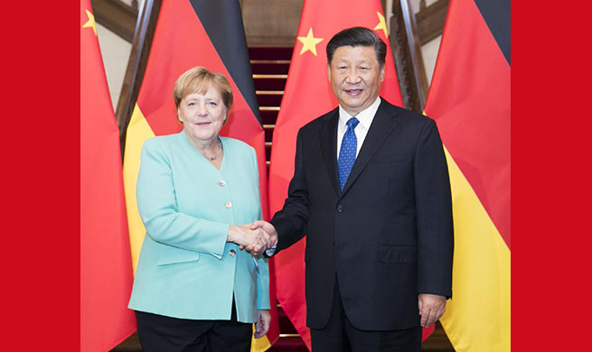 Xi meets with German Chancellor Angela Merkel
