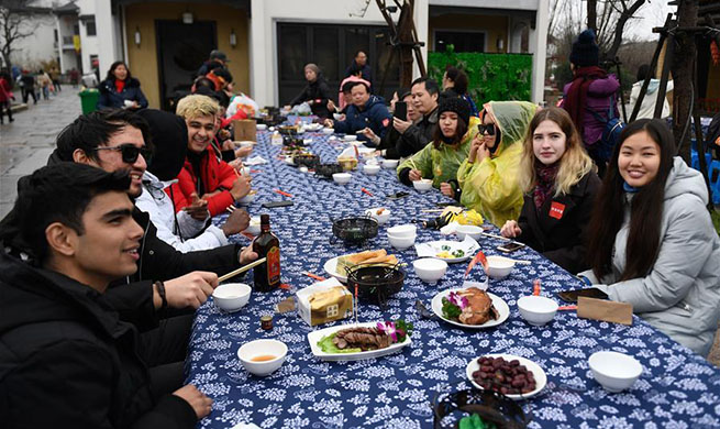 People attend long-table feast marking upcoming Chinese Lunar New Year in China's Zhejiang