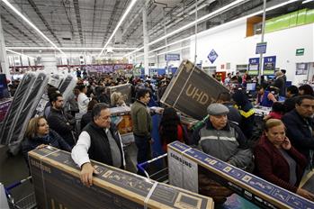 People shop in self-service store during "The Irresistible Weekend" in Mexico City