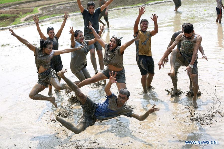 NEPAL-LALITPUR-NATIONAL PADDY DAY FESTIVAL-MUD FUN