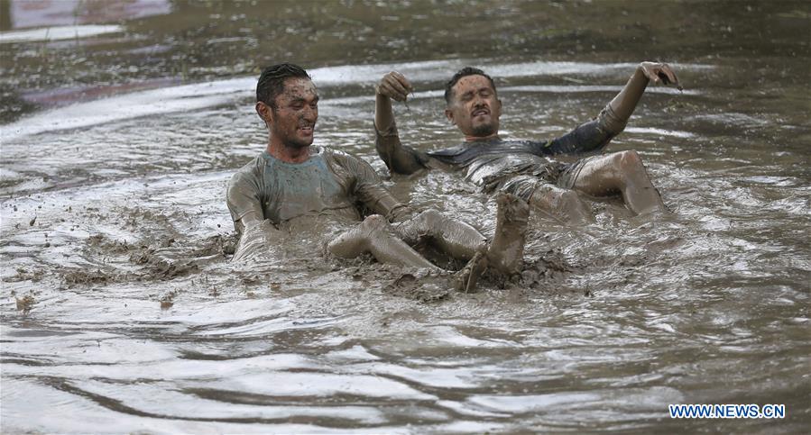 NEPAL-LALITPUR-NATIONAL PADDY DAY FESTIVAL-MUD FUN