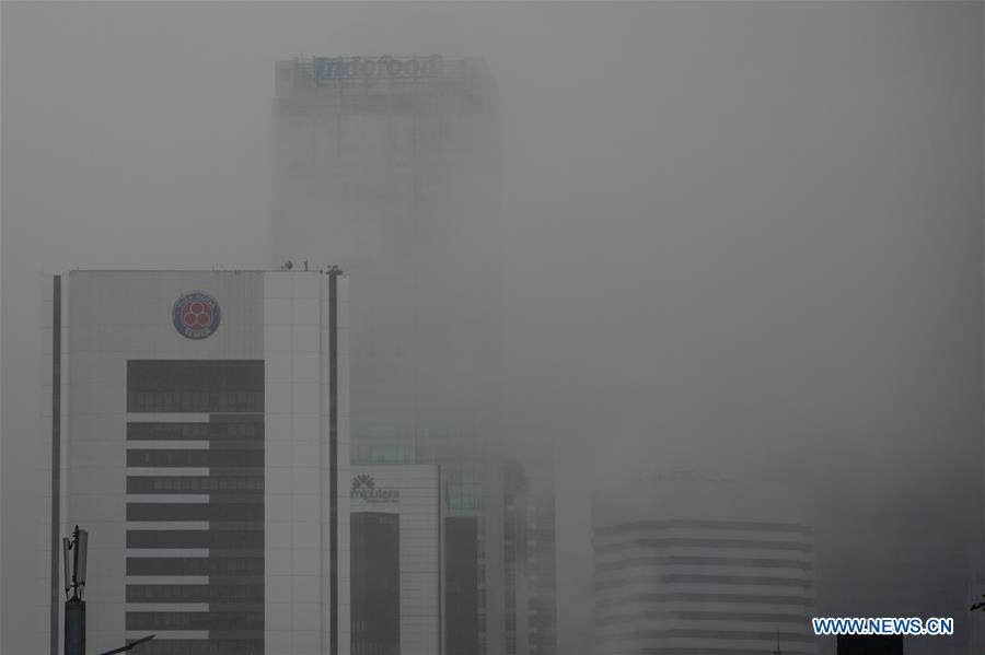INDONESIA-JAKARTA-WEATHER-FOG AND RAIN