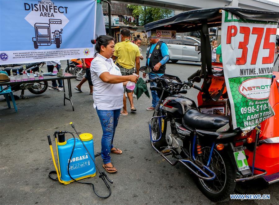 PHILIPPINES-COVID-19-METRO-CURFEW-TRICYCLE 