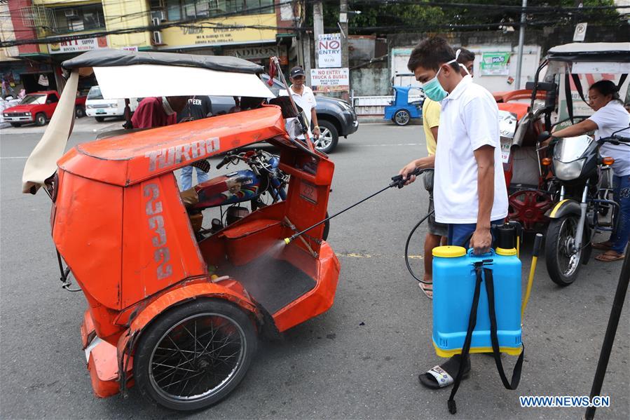 PHILIPPINES-COVID-19-METRO-CURFEW-TRICYCLE 