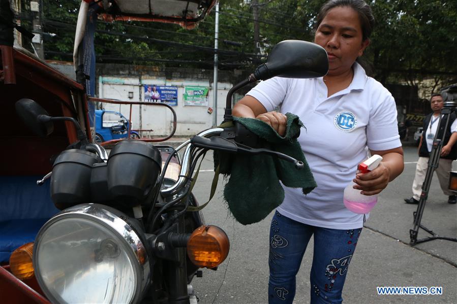 PHILIPPINES-COVID-19-METRO-CURFEW-TRICYCLE 