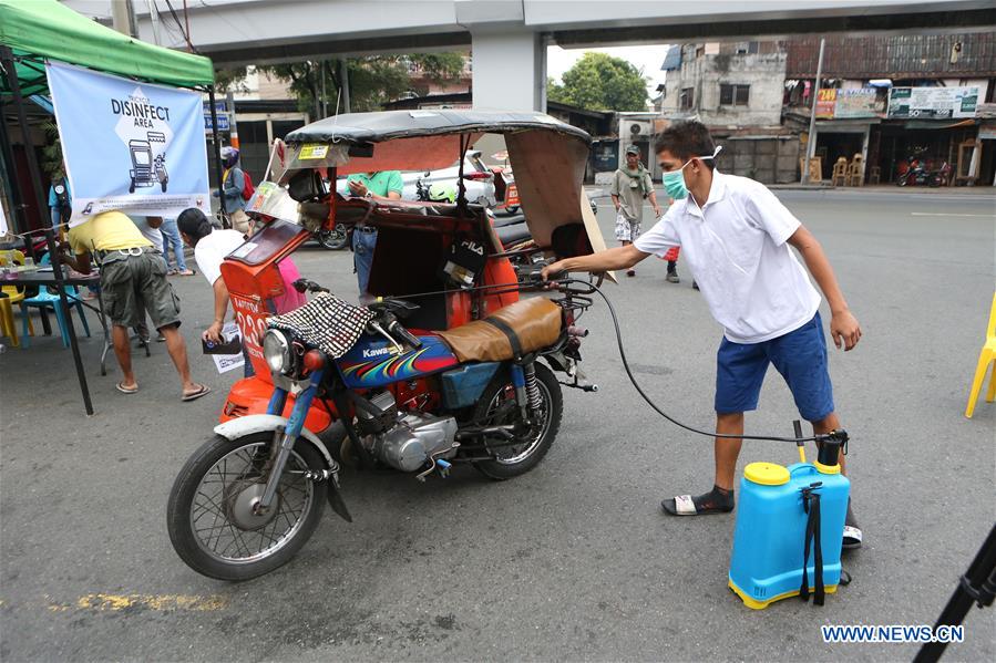 PHILIPPINES-COVID-19-METRO-CURFEW-TRICYCLE 
