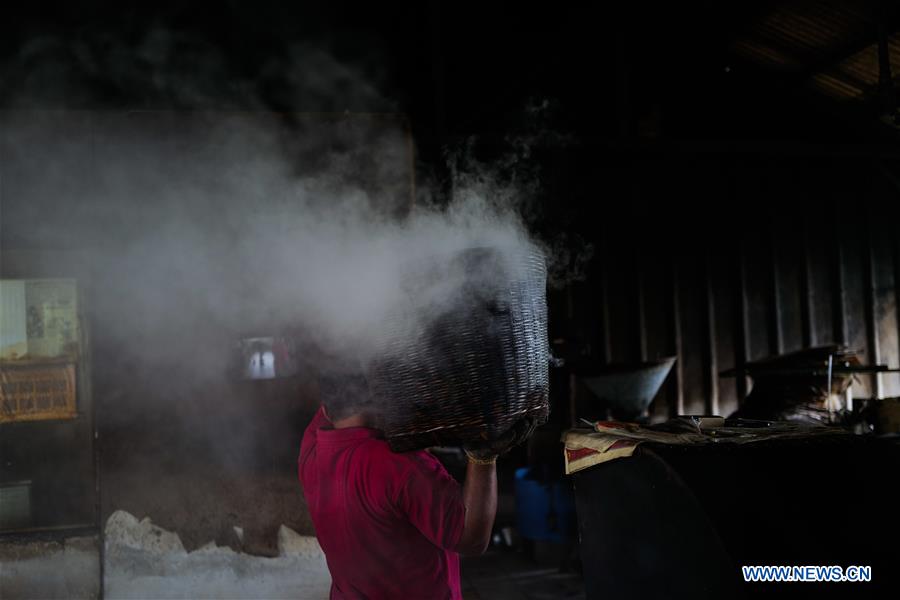 Pic story family business heir dedicated to producing charcoal roasted
