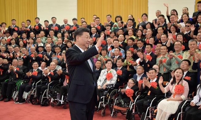 Xi meets role models with disabilities, their outstanding supporters