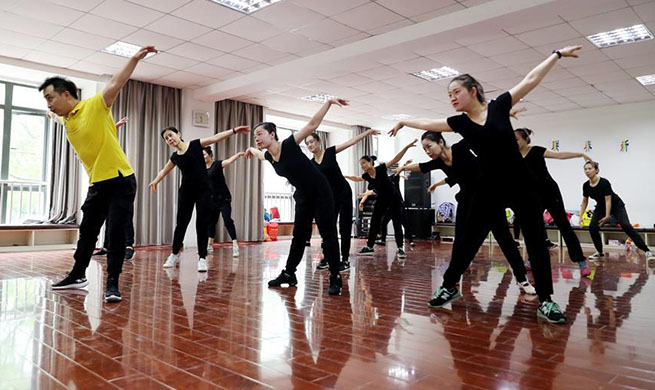 In pics: dance group composed of hearing-impaired people in Shanghai