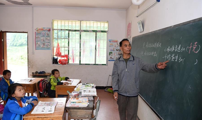 Pic story: rural teacher sticks to post for decades in S China's Guangxi