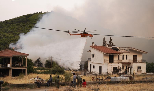 Greek fire fighters battling largest wildfires of this summer near Athens