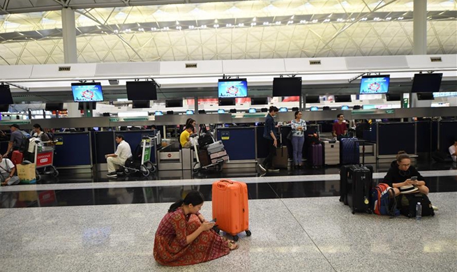 Hong Kong cancels most of outbound flights as protesters disrupt airport