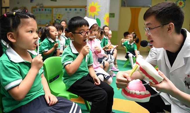 Dental care activity held in kindergarten in Hefei, E China's Anhui