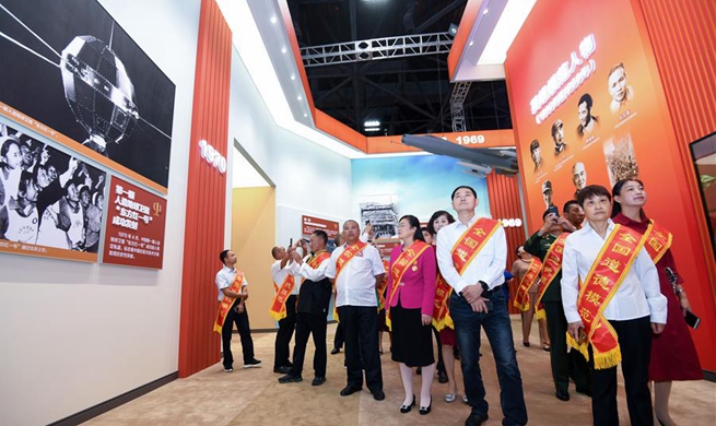 Role models invited to tour grand exhibition in Beijing