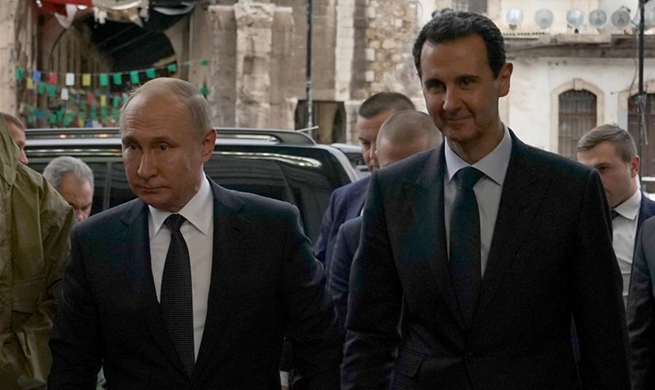 Putin visits Damascus, meets Syrian president