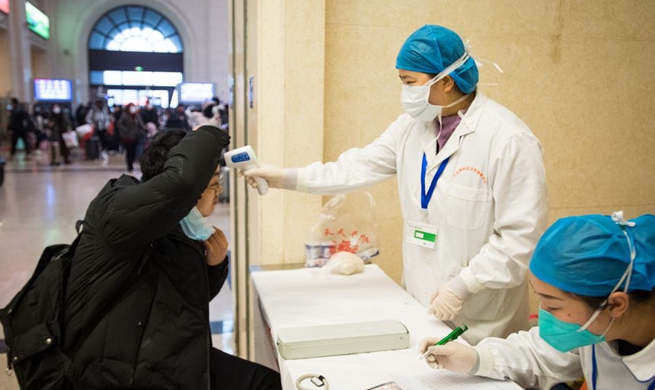 Xinhua Headlines: China goes all out to contain novel coronavirus amid travel rush