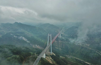Fog-shrouded Qingshuihe bridge in southwest China's Guizhou