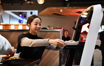 Robots serve food in smart restaurant in Tianjin