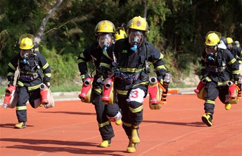 Fire fighters participate in drill in Xiamen, southeast China's Fujian