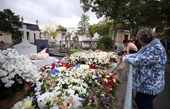 People mourn Jacques Chirac at Montparnasse cemetery in Paris