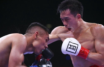 Chinese boxer Xu Can defends WBA featherweight title