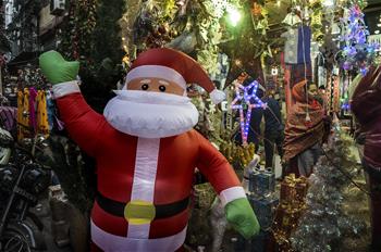 People buy Christmas decorations at market in Kolkata, India 