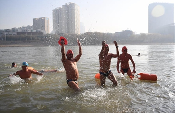 Winter swimmers plunge into Yellow River in Lanzhou, NW China's Gansu