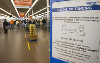 Customers wearing face masks shop at supermarket in Mississauga, Canada