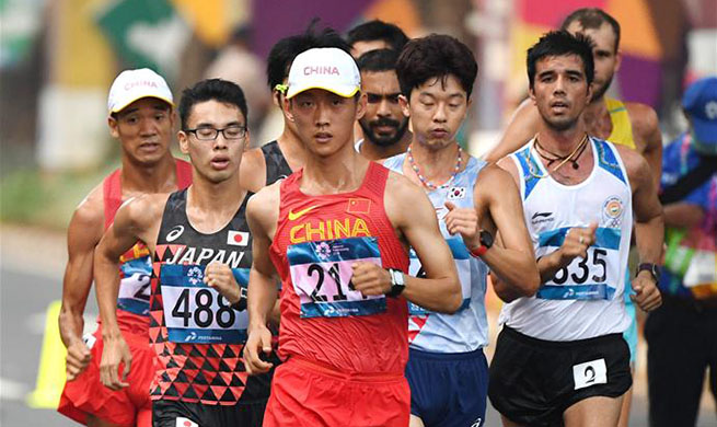 Wang Kaihua wins gold medal of men's 20km walk of athletics