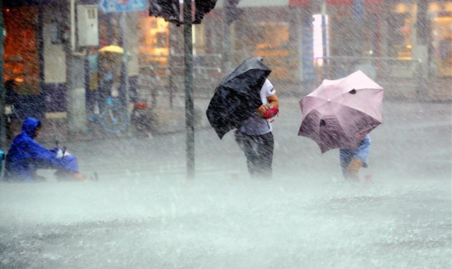 Shanghai issues orange alert as Typhoon Lekima lands