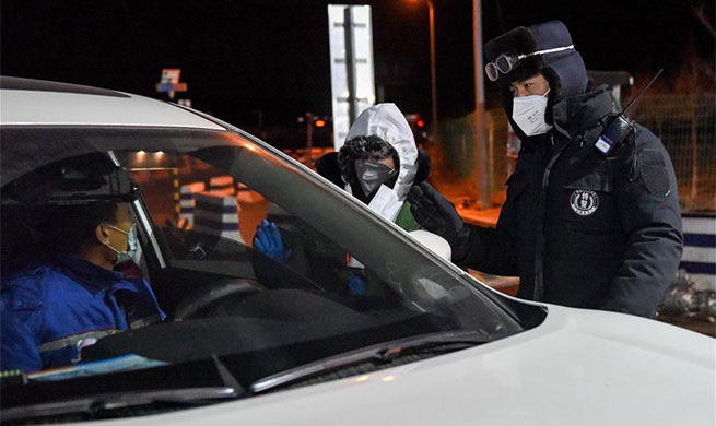 People work late into night to help fight aganist epidemic in Xinjiang