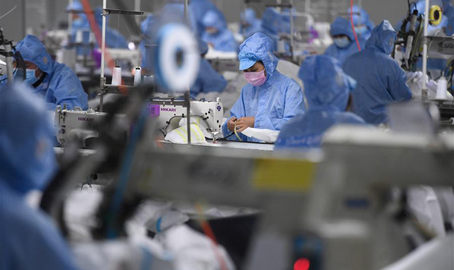 Production lines set up to produce protective suits in Deqing County, E China's Zhejiang