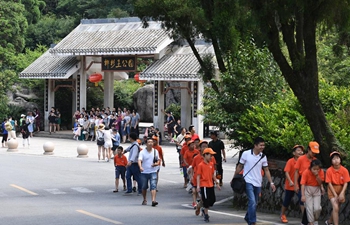 Tourists have fun in Guling Hill, Fuzhou, SE China's Fujian