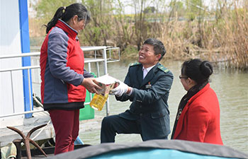 Pic story of postman Tang Zhenya in China's Jiangsu