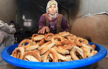 Residents of Malatya make traditional food "simit" in Turkey