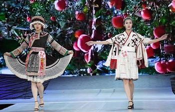 Traditional ethnic costumes presented during fashion show in Yunnan