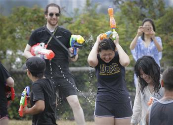People participate in annual water fight in Vancouver, Canada