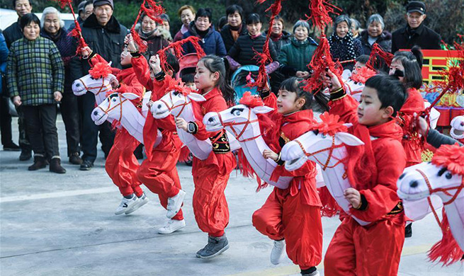 Children perform traditional folk dance to greet Spring Festival in China's Zhejiang