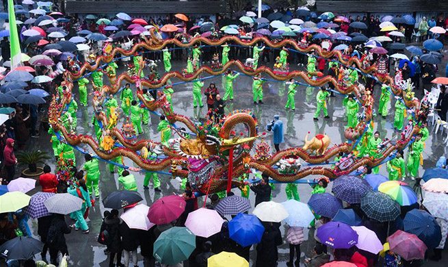 Wooden-bench dragon dance performed to celebrate Chinese Lantern Festival in east China's Zhejiang