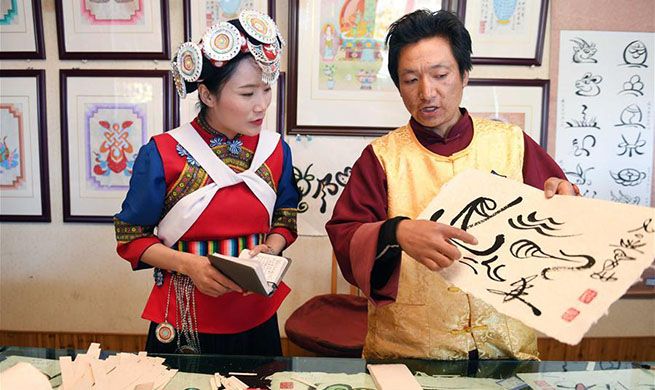 NPC deputy Fan Yongzhen dedicated to protecting, promoting local ethnic cultures