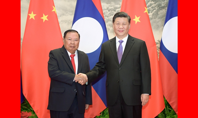 Xi holds talks with Lao president to promote ties