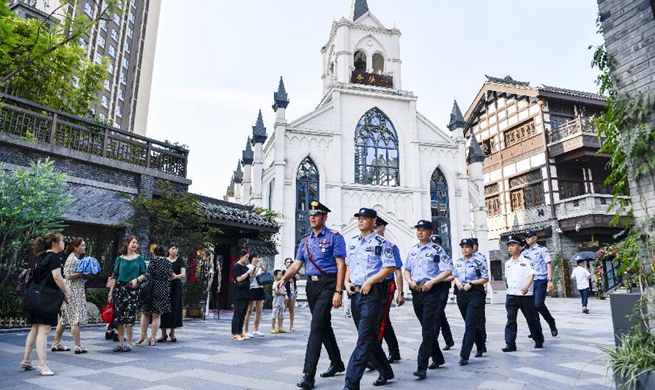 Chinese and Italian police officers patrol in Chongqing's popular tourist spots