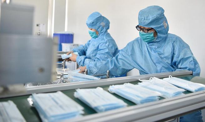 Workers across China make face masks to ensure supply