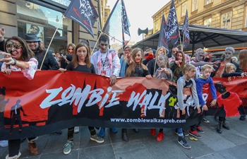 People take part in "Zombie Walk" in Zagreb, Croatia